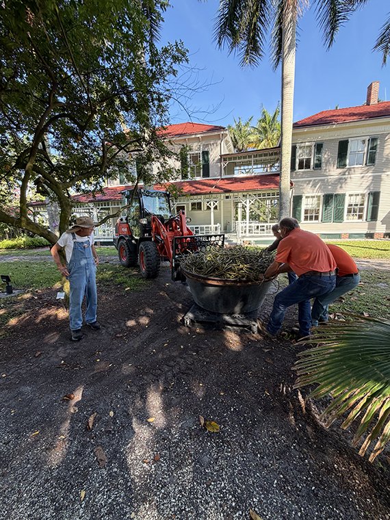 Robert Reifer watches the team with Creel Tractor move his 800-pound orchid into place in front of the historic Edison home.