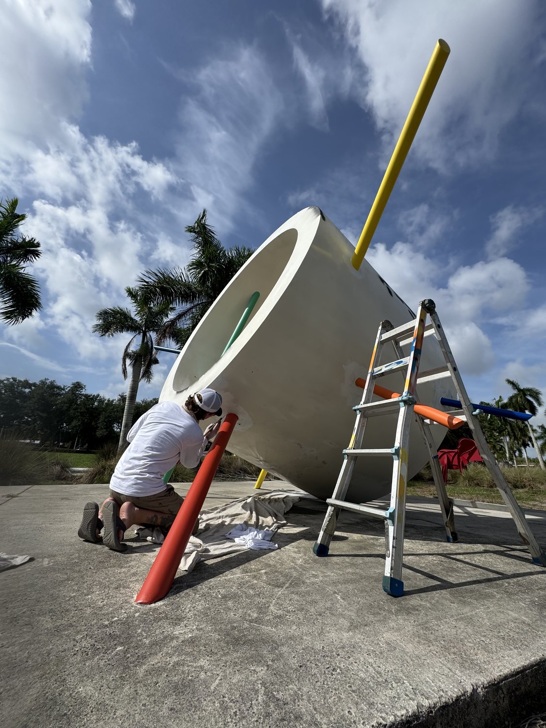 Jason Sanders restoring the You Are Here sculpture