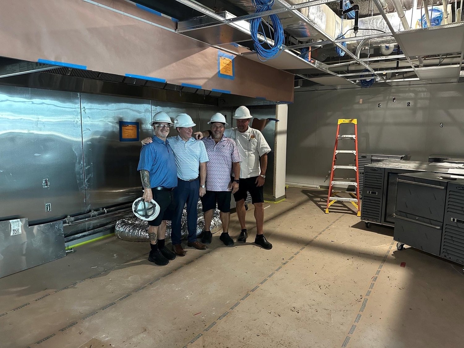 Club and construction team in the Waterside kitchen area