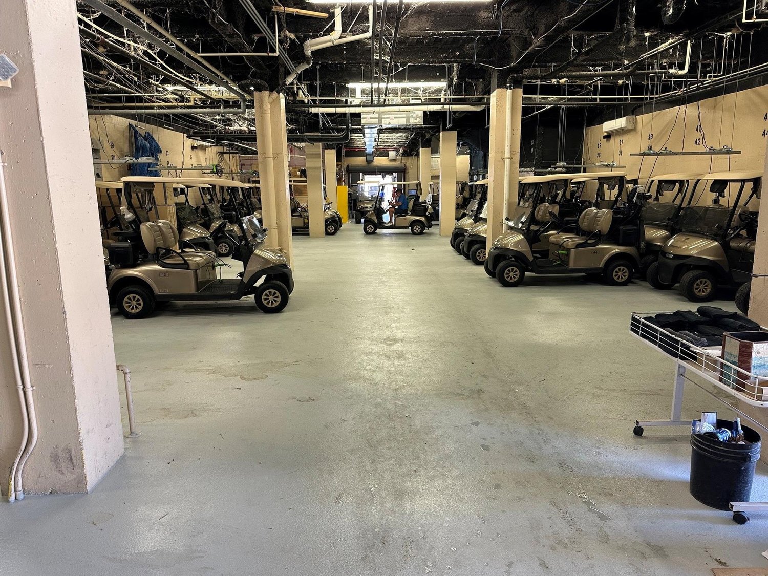 Golf carts parked on the new cart barn floor