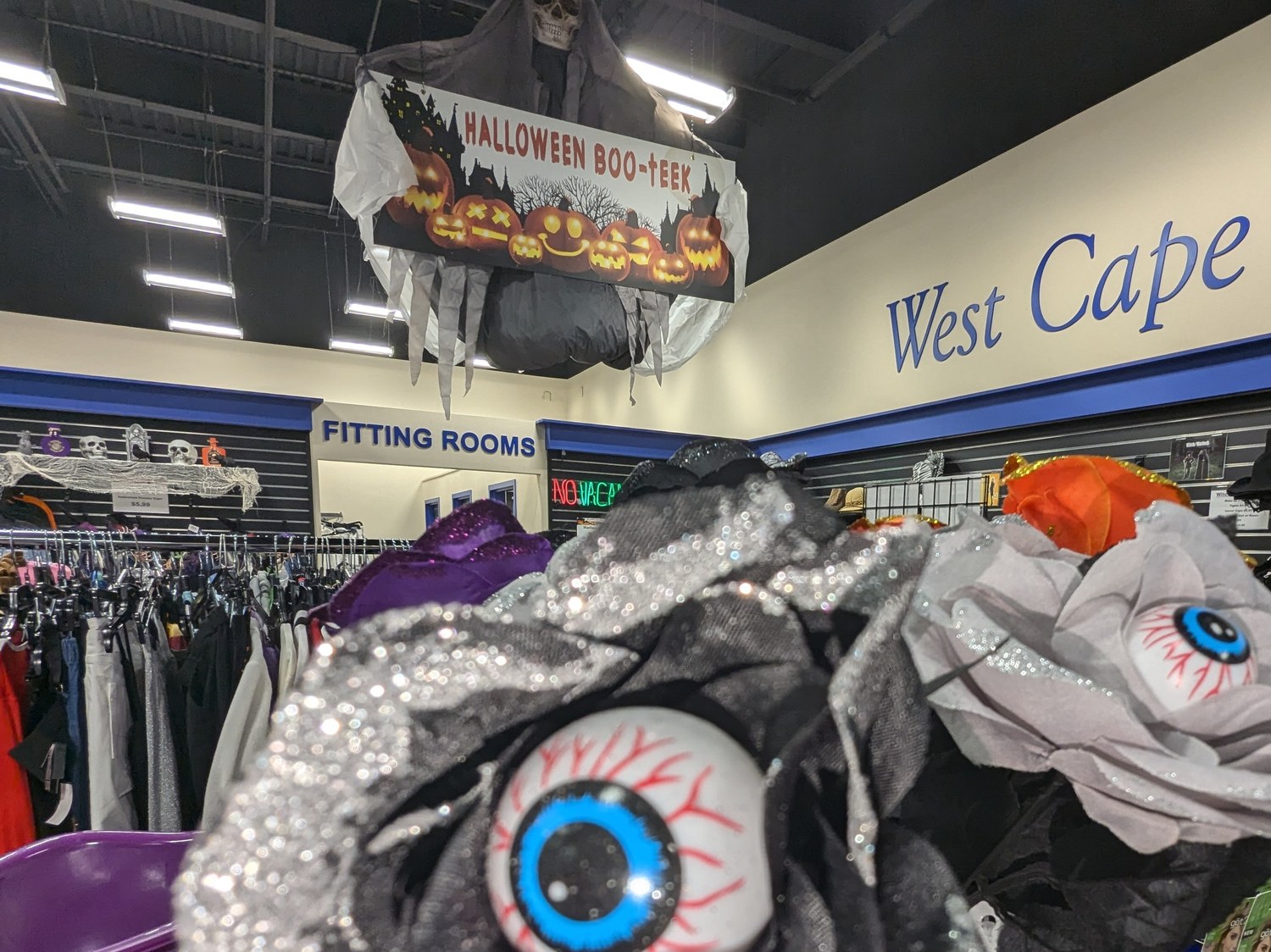 Halloween Boo-teek sign and costume racks inside a Goodwill Southwest Florida store
